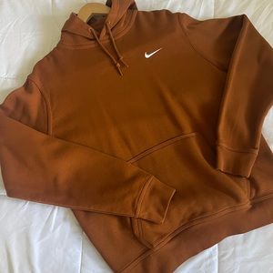 Nike sweater. Women’s large. Burnt orange sort of color.